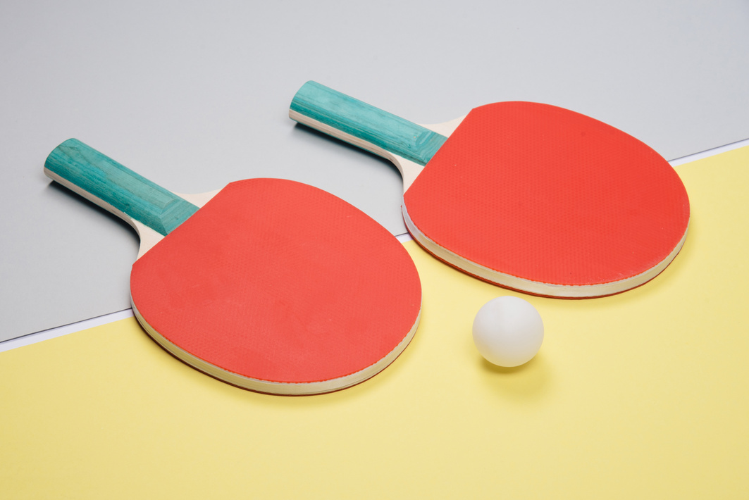 Table Tennis Rackets and a Ball Flatlay